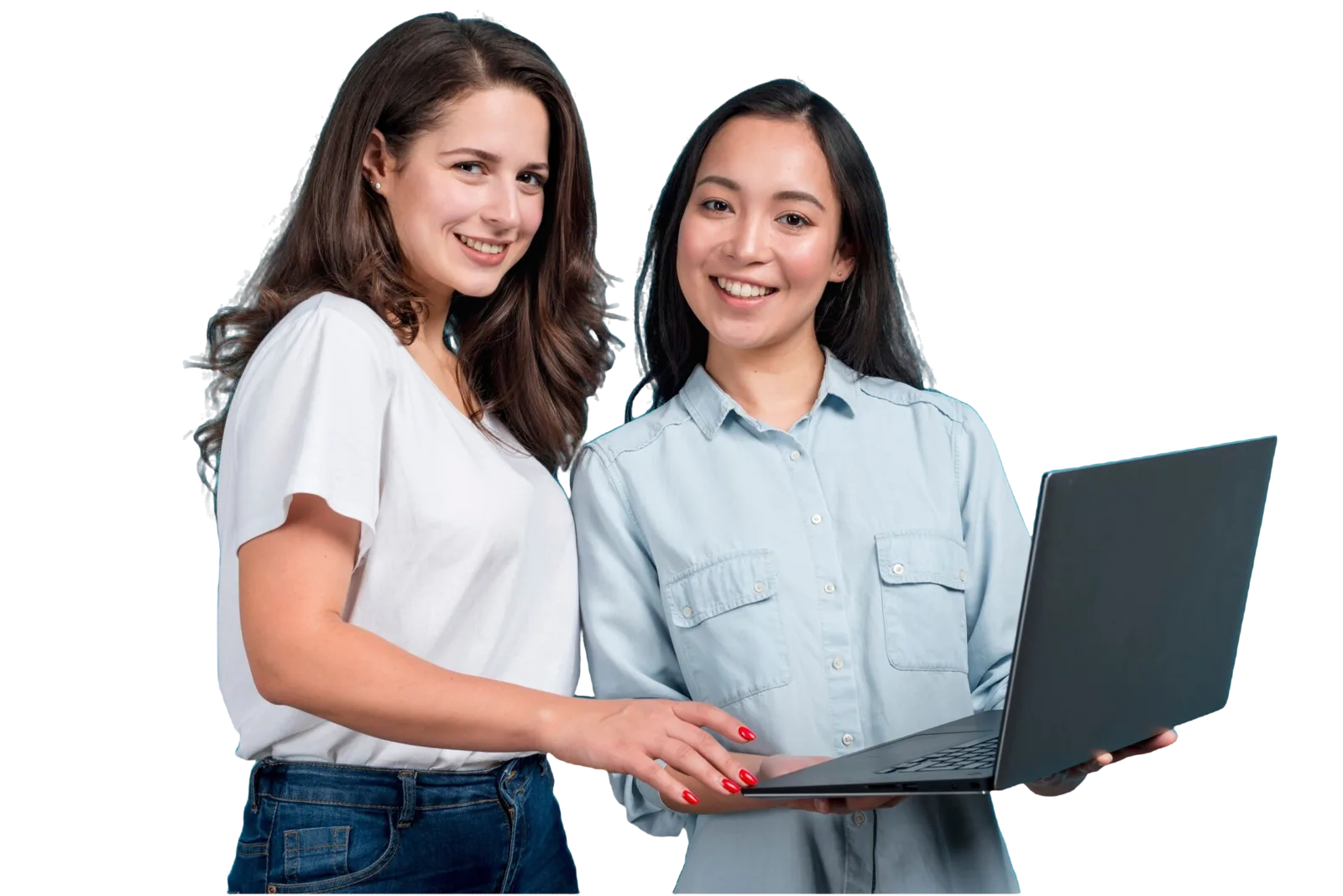 Two smiling students looking at a laptop together