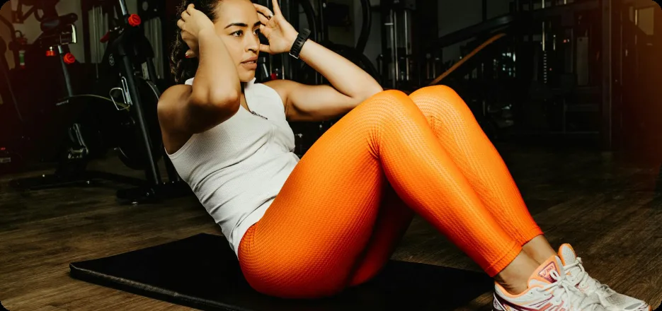 Member finishing a set of floor crunches