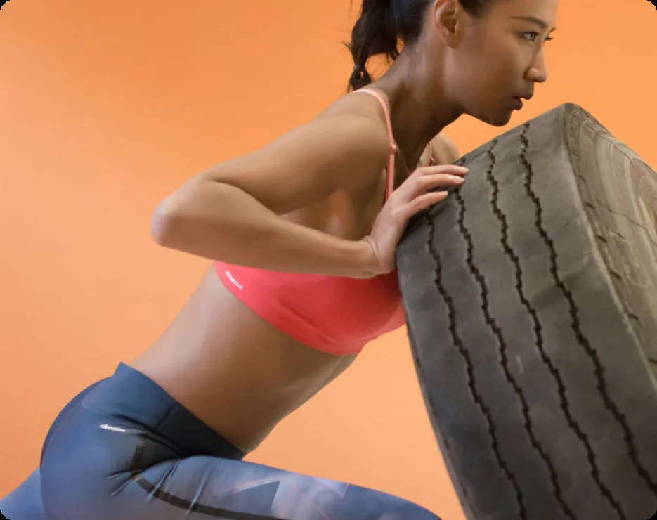 Athlete flipping a training tyre