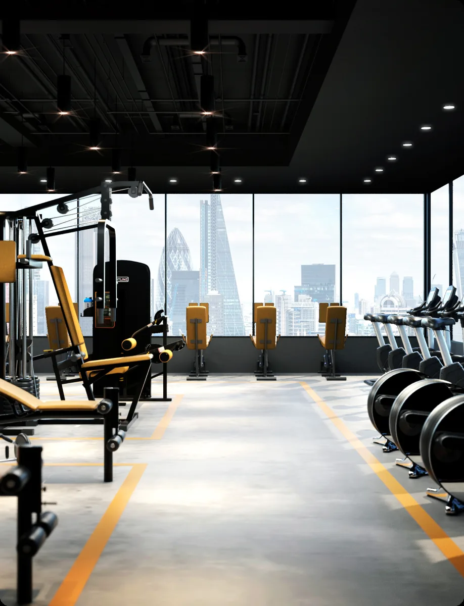 Uptown Studio weights and cardio floor overlooking the city skyline