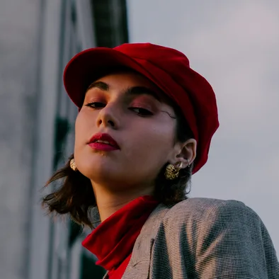 Woman in a red beret and a red scarf