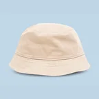 Beige bucket hat on a pale blue ground