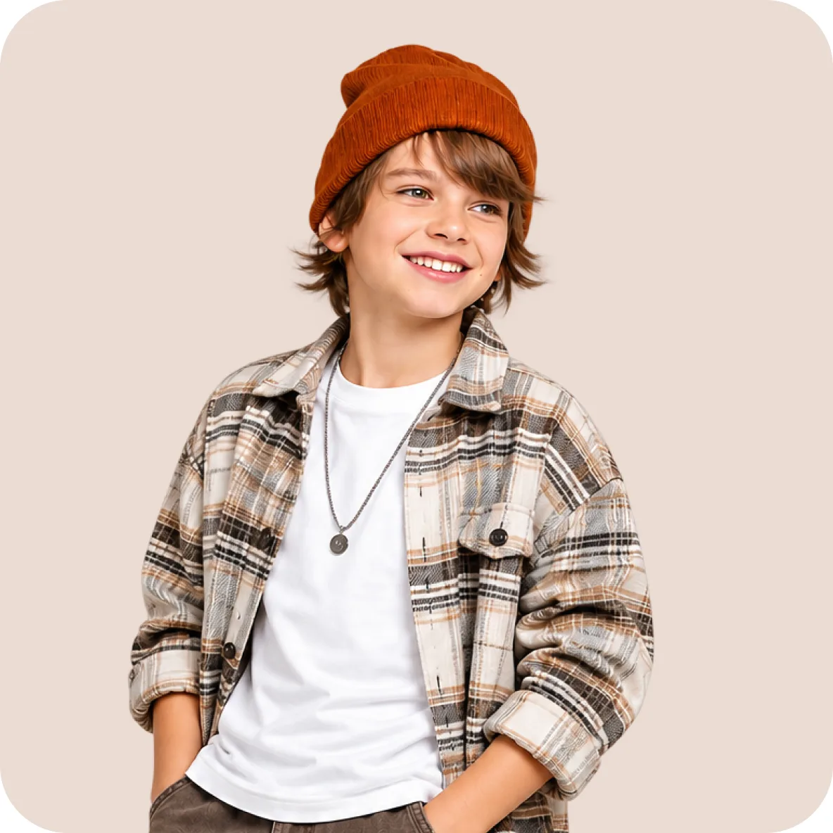 Boy in a rust beanie and a plaid flannel shirt